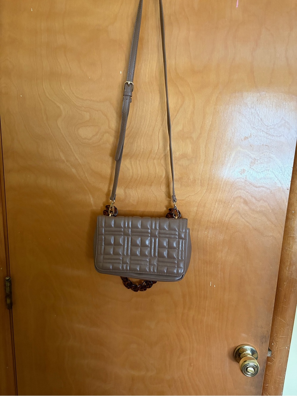 Like Dreams Taupe Quilted Crossbody Bag with Tortoise Chain Accent.
